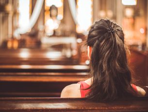 Woman visiting a christian church